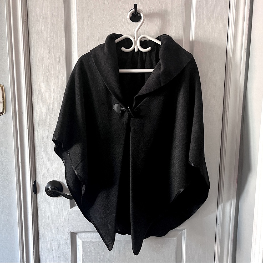 Woman’s dark grey cape